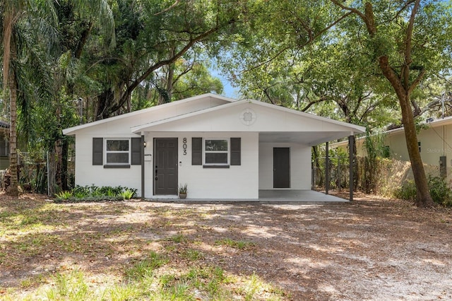 single story home with a carport