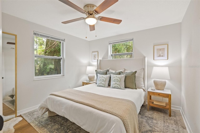 bedroom with ceiling fan and wood-type flooring