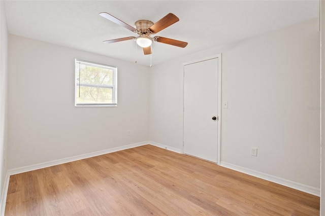 empty room featuring light wood-type flooring and ceiling fan