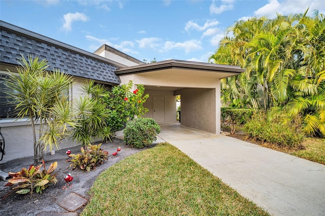 view of front of home featuring a carport