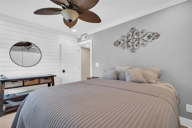 bedroom featuring ceiling fan and ornamental molding