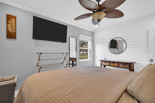 bedroom with ceiling fan and ornamental molding