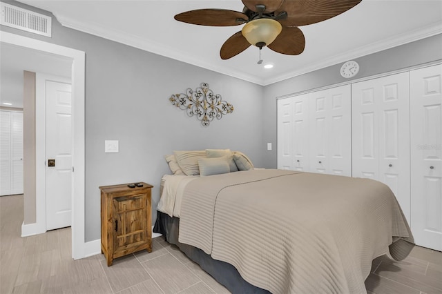 bedroom featuring ceiling fan, a closet, and crown molding