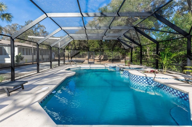 view of pool featuring a patio and glass enclosure