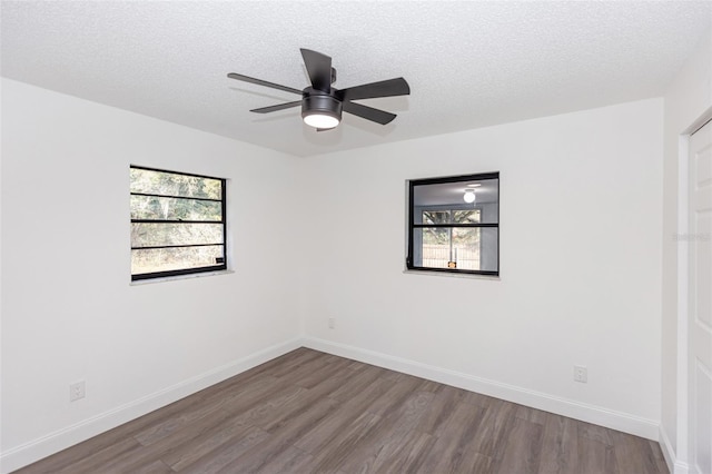 spare room with ceiling fan, a textured ceiling, and hardwood / wood-style floors