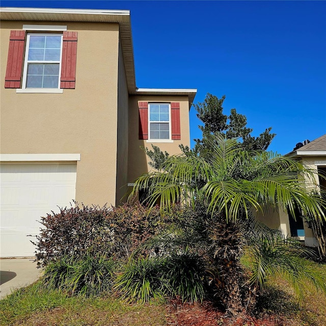 view of home's exterior with a garage