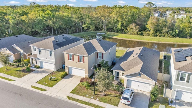 bird's eye view with a forest view, a residential view, and a water view