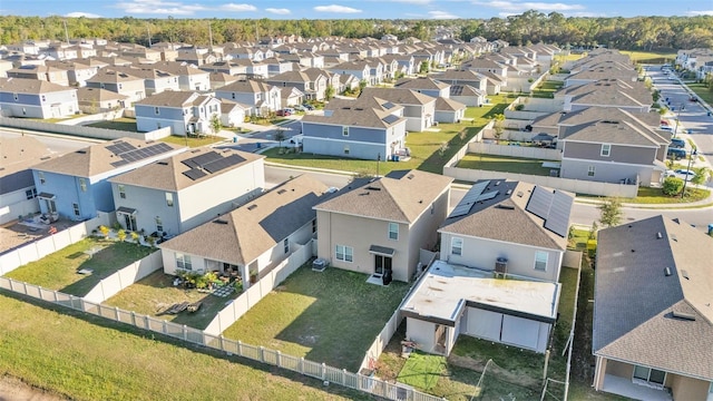 birds eye view of property with a residential view