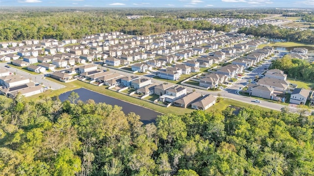 bird's eye view featuring a residential view and a water view