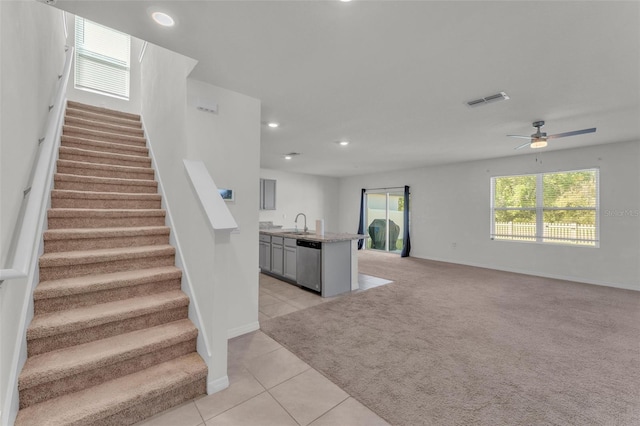 interior space featuring recessed lighting, visible vents, carpet floors, and tile patterned flooring