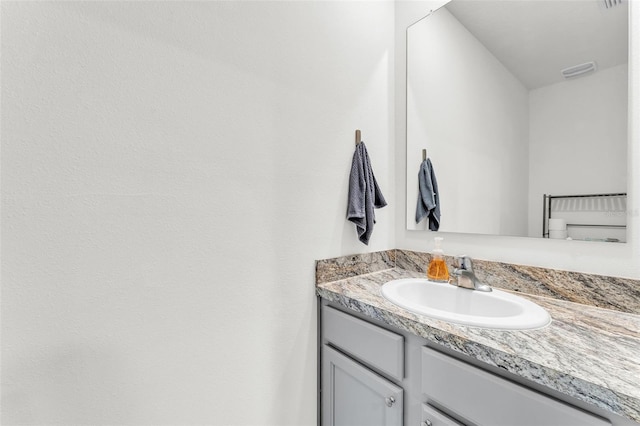 bathroom featuring visible vents and vanity