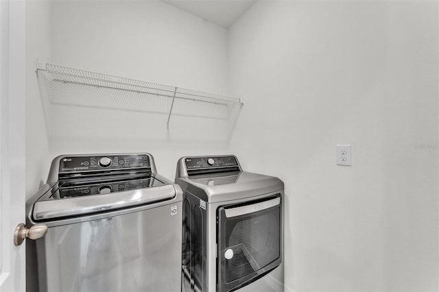 laundry area featuring washing machine and dryer and laundry area