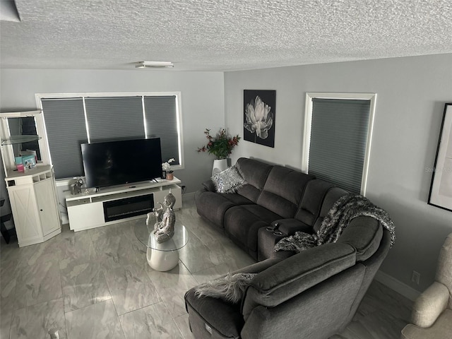 living room with a textured ceiling