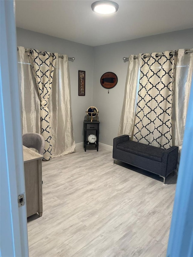 living area with hardwood / wood-style floors