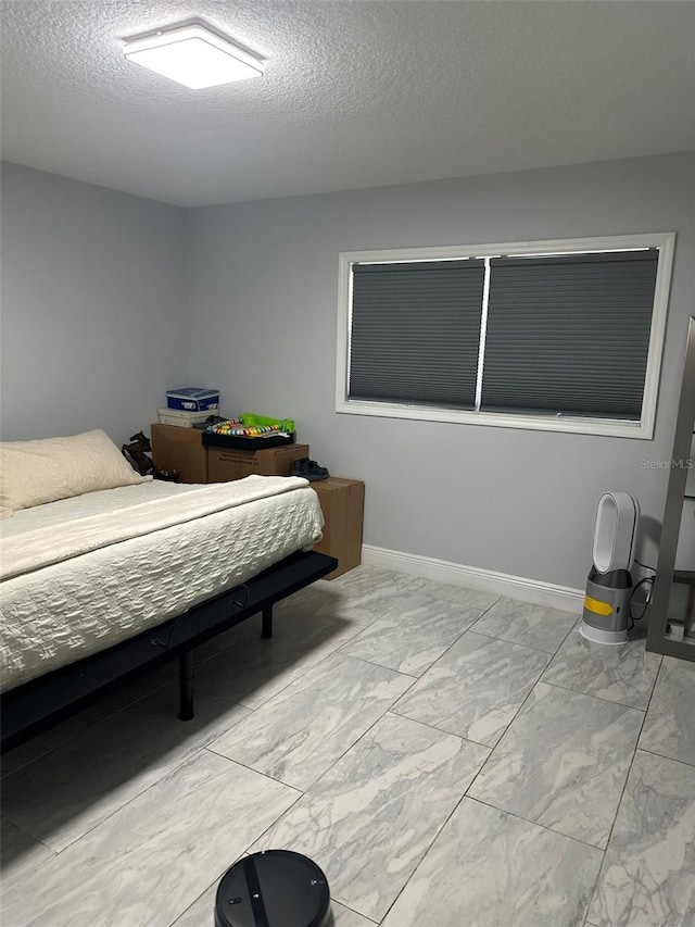 bedroom featuring a textured ceiling