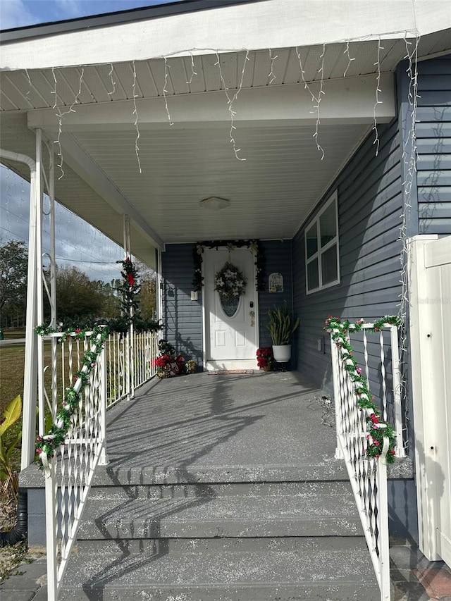 entrance to property with a porch