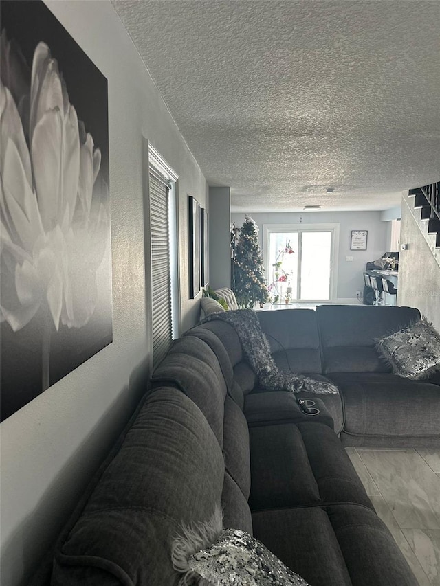 living room featuring a textured ceiling