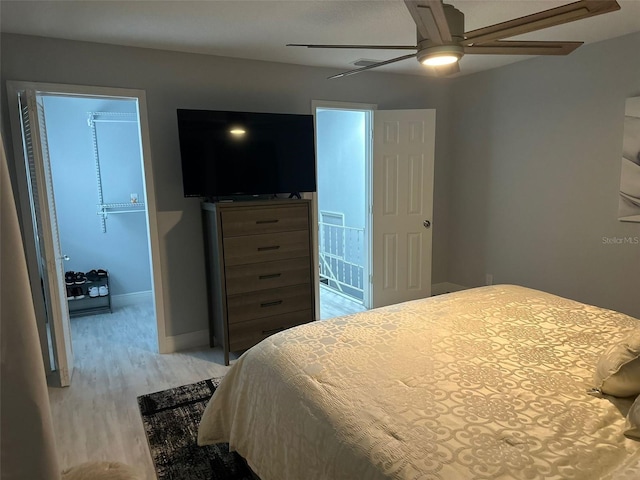 bedroom with ceiling fan and light wood-type flooring