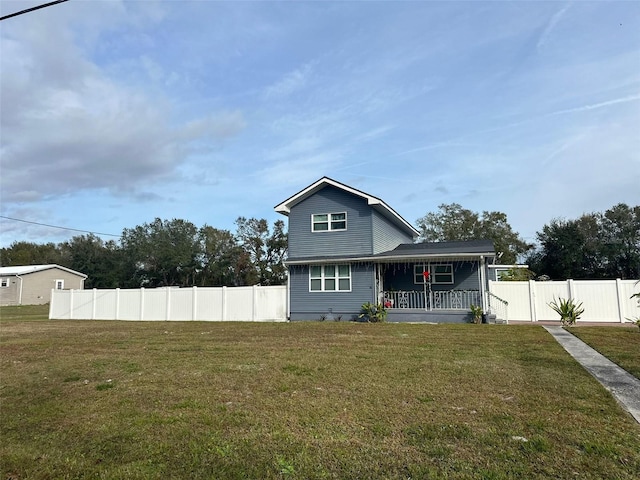 view of front of house featuring a porch and a front yard