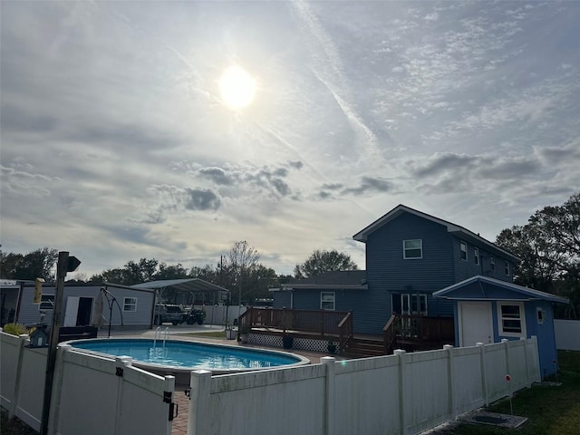 view of pool featuring a wooden deck