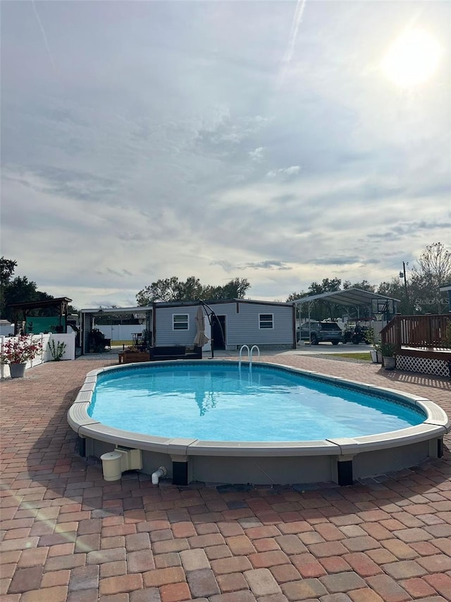 view of pool featuring a wooden deck