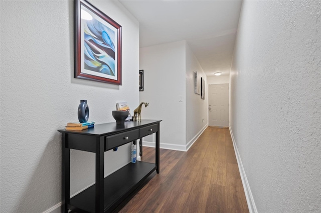 hallway featuring dark hardwood / wood-style floors