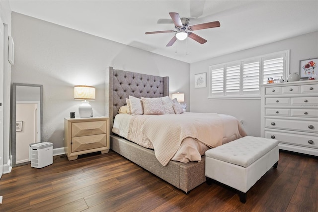 bedroom with ceiling fan and dark wood-type flooring