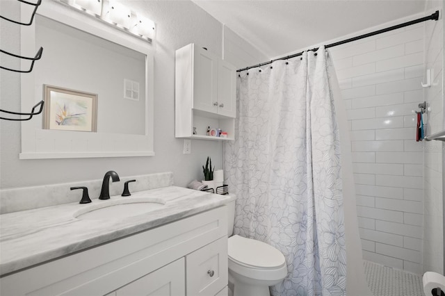 bathroom featuring toilet, vanity, and a shower with curtain