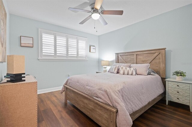 bedroom with ceiling fan and dark hardwood / wood-style flooring