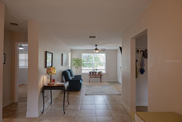 corridor featuring light tile patterned flooring