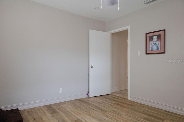 unfurnished room featuring light hardwood / wood-style floors