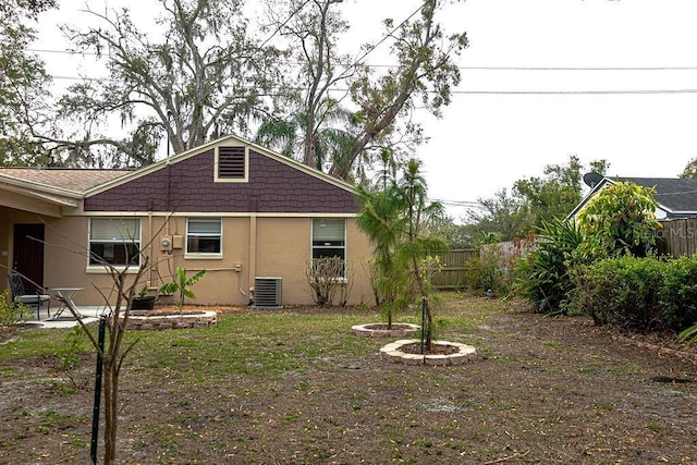 back of property with central AC unit