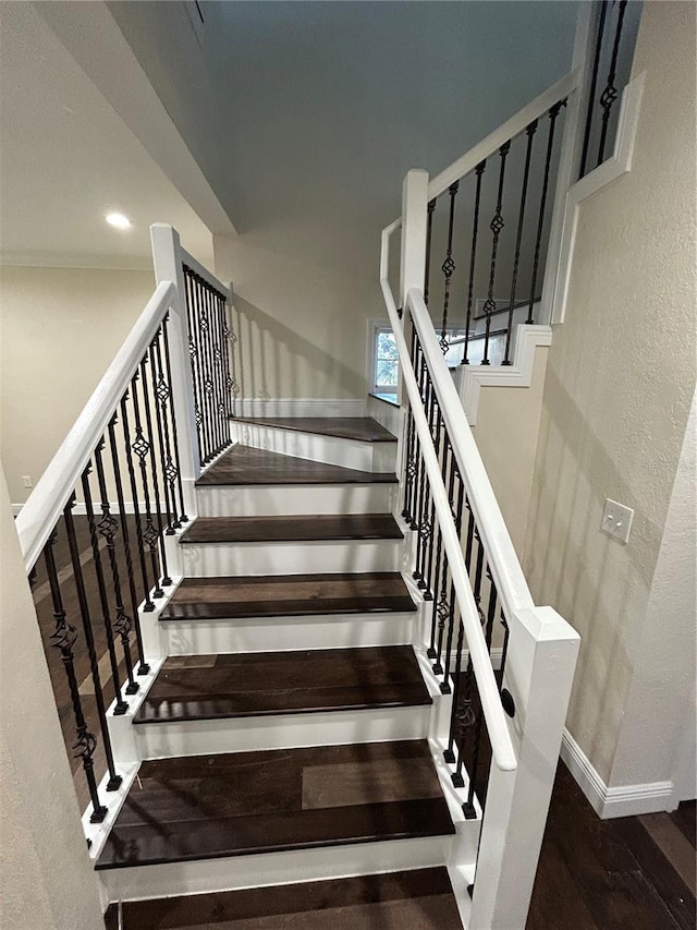 stairs with hardwood / wood-style flooring