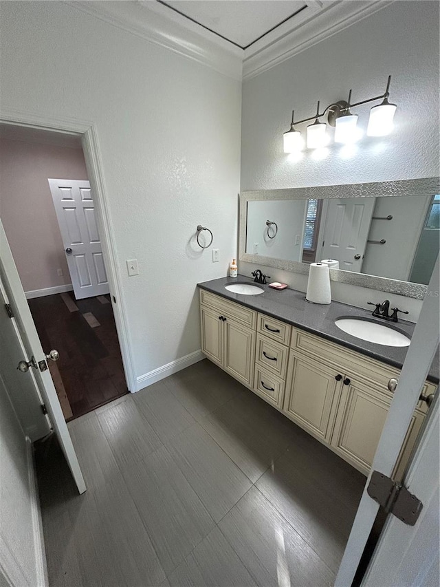 bathroom with vanity and ornamental molding