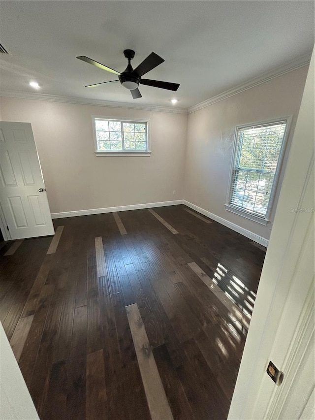 unfurnished room featuring ceiling fan, dark hardwood / wood-style floors, and ornamental molding