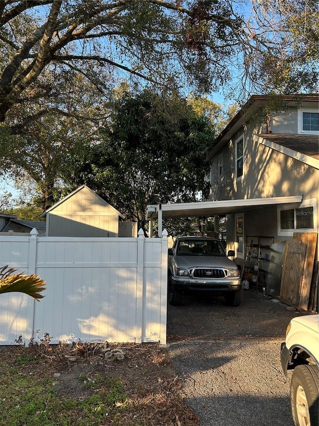 view of home's exterior with a carport