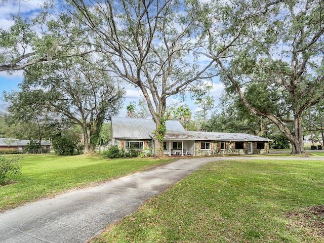 ranch-style home with a front lawn