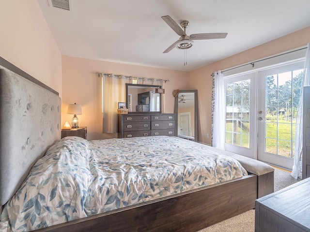 carpeted bedroom with ceiling fan and french doors