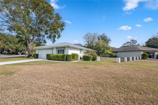 single story home with a garage and a front yard