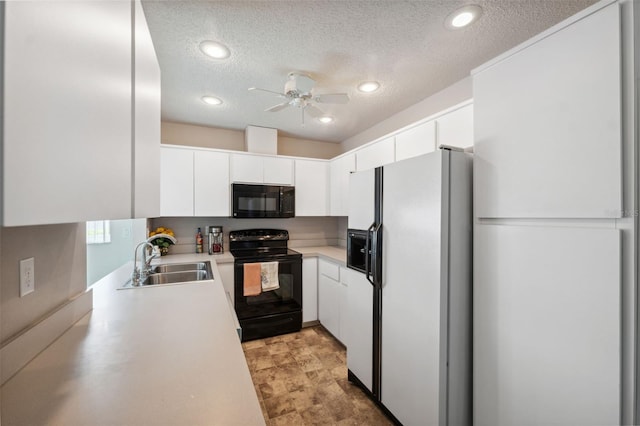 kitchen featuring black appliances, sink, white cabinetry, and a textured ceiling