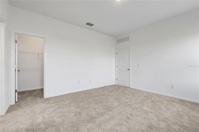 empty room with light colored carpet