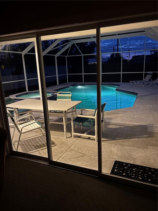 view of pool at dusk