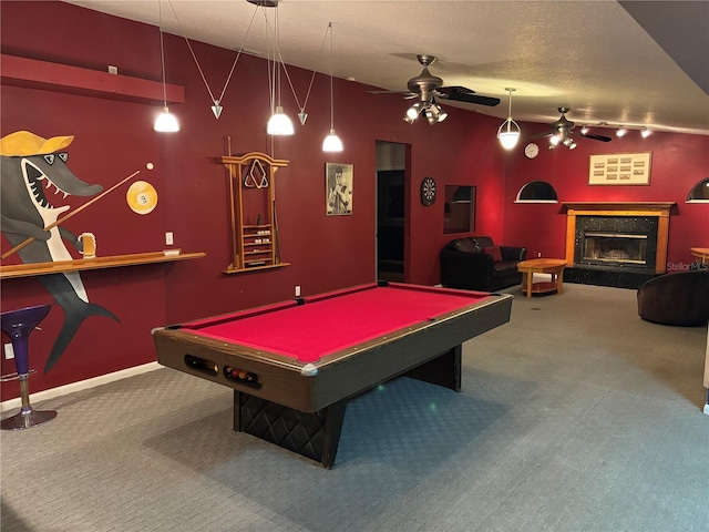 playroom with a textured ceiling, ceiling fan, carpet flooring, and pool table