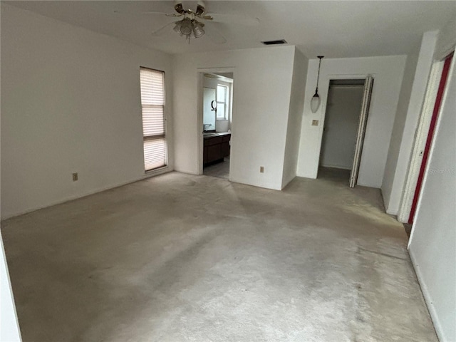 unfurnished room featuring ceiling fan