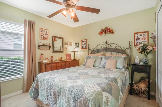 bedroom featuring ceiling fan and light colored carpet