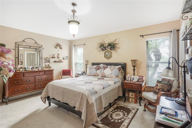 bedroom with light colored carpet