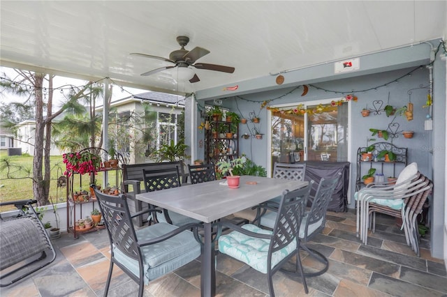 sunroom / solarium featuring ceiling fan and a healthy amount of sunlight