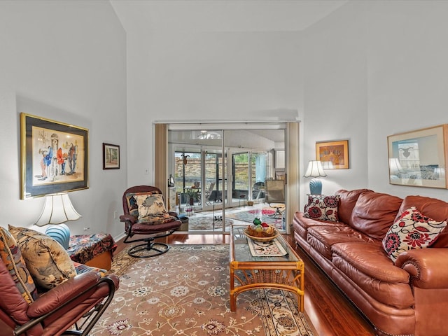 living room featuring a towering ceiling