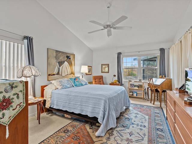 carpeted bedroom featuring vaulted ceiling and ceiling fan