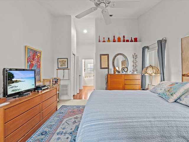 bedroom featuring ceiling fan and ensuite bathroom